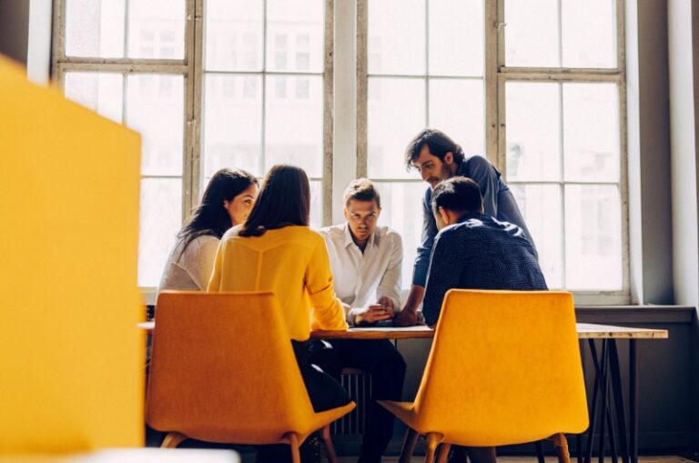 Group of young people in marketing discusses how to increase marketing effectiveness index