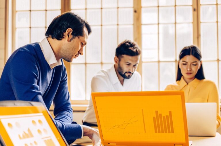 Team of modern professionals uses artificial intelligence for SEO data analysis at TWO DOTS, focusing on content optimization