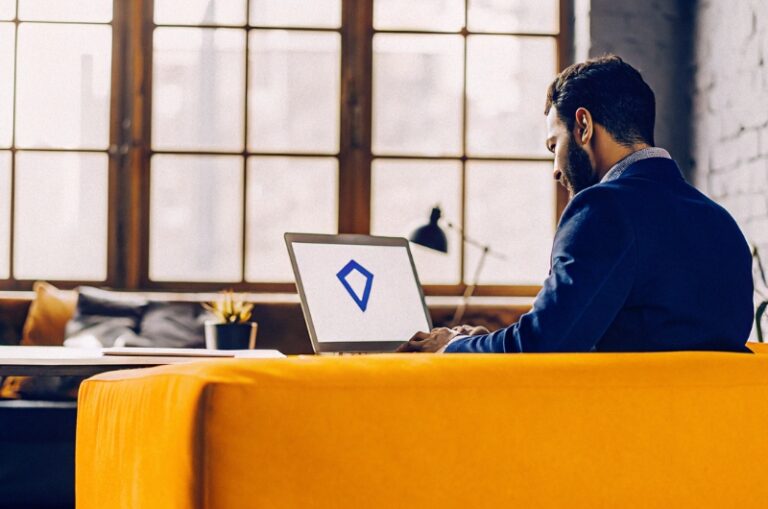 Professional manages his business's Google My Business profile on the desktop, enhancing TWO DOTS local web presence