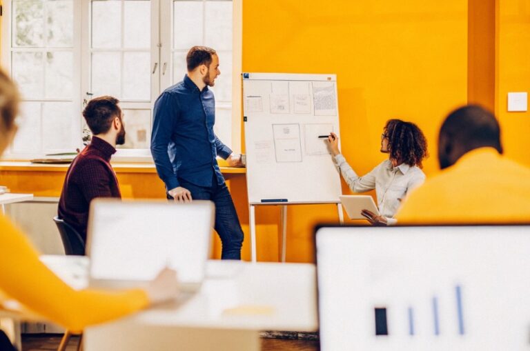 UX designer presents to his team two alternatives for pop up based on the TWO DOTS strategy