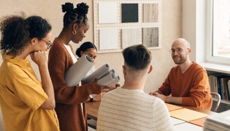 Creative team in bright studio working on visual identity and branding for TWO DOTS digital experience